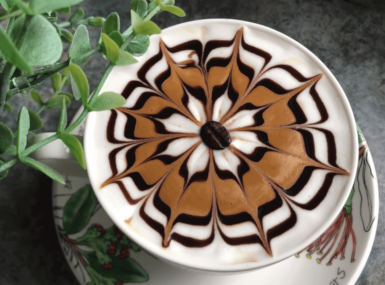 4 flores de café con leche ligeramente diferentes Arte del café